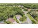 Scenic aerial view of a lovely home nestled among lush trees in a tranquil residential neighborhood at 4797 Stonebriar Dr, Oldsmar, FL 34677