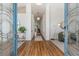 Inviting foyer featuring an elongated hallway, stylish decor, and a view to the living area at 4797 Stonebriar Dr, Oldsmar, FL 34677