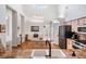 Well-lit kitchen featuring granite countertops, an island, and stainless steel appliances, great for culinary enthusiasts at 4797 Stonebriar Dr, Oldsmar, FL 34677
