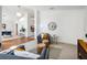 Open-concept living area with a view to the dining space, modern furnishings, and natural light at 4797 Stonebriar Dr, Oldsmar, FL 34677