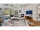 Bright living room with fireplace and access to an outdoor pool and patio at 4797 Stonebriar Dr, Oldsmar, FL 34677