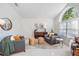 Cozy living room with vaulted ceilings, chic furnishings, and a bright, airy ambiance at 4797 Stonebriar Dr, Oldsmar, FL 34677