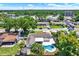 Aerial view of a single-Gathering home with a private backyard swimming pool at 5008 Stolls Ave, Tampa, FL 33615