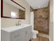This bathroom features a stylish vanity with modern fixtures and a tiled walk-in shower at 5008 Stolls Ave, Tampa, FL 33615