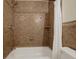 Bathroom featuring a shower with decorative tile surround and white shower curtain at 5008 Stolls Ave, Tampa, FL 33615