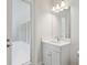 Bathroom vanity with a sleek mirror and a door to the outside at 5116 Wildwind Dr, Apollo Beach, FL 33572