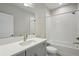 Well-lit bathroom with a white vanity, a large mirror, and a shower-tub combination at 5116 Wildwind Dr, Apollo Beach, FL 33572