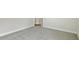 Expansive bedroom with soft neutral carpeting and doorways leading to other rooms at 5116 Wildwind Dr, Apollo Beach, FL 33572