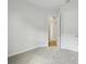 Neutrally painted bedroom featuring soft carpeting and an open doorway at 5116 Wildwind Dr, Apollo Beach, FL 33572