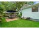 Charming backyard with a patio area, lush lawn, and tasteful landscaping at 535 31St N Ave, St Petersburg, FL 33703