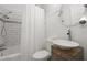 Bright bathroom featuring a tub-shower, vanity, toilet, and decorative mirror at 535 31St N Ave, St Petersburg, FL 33703