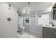 Modern bathroom features a tiled shower, stylish vanity, and updated fixtures at 535 31St N Ave, St Petersburg, FL 33703
