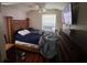 Bedroom featuring a bed with a wooden headboard, dresser, and ceiling fan at 535 31St N Ave, St Petersburg, FL 33703