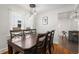 Bright dining room with a wood table, hardwood floors, and modern pendant lighting fixtures at 535 31St N Ave, St Petersburg, FL 33703