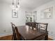 Bright dining room featuring hardwood floors, a wood table and modern pendant lighting fixtures at 535 31St N Ave, St Petersburg, FL 33703