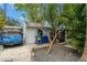 Exterior view with a blue van parked in the driveway with landscaping at 535 31St N Ave, St Petersburg, FL 33703