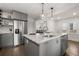 Contemporary kitchen with marble island, stainless steel appliances, and updated fixtures for a chef-inspired experience at 535 31St N Ave, St Petersburg, FL 33703