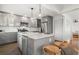 Modern kitchen featuring a marble island with bar seating, stainless steel appliances, and ample storage space at 535 31St N Ave, St Petersburg, FL 33703