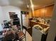 A kitchen with lots of appliances, white refrigerator, and wooden cabinets at 535 31St N Ave, St Petersburg, FL 33703