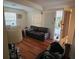 Cozy living room featuring hardwood floors, a comfortable sofa, and natural lighting at 535 31St N Ave, St Petersburg, FL 33703