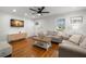 Inviting living area with hardwood floors, stylish furnishings, and a wall-mounted TV, creating a cozy atmosphere at 535 31St N Ave, St Petersburg, FL 33703
