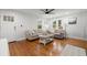Bright living room with hardwood floors, neutral furniture, and large windows that offer plenty of natural light at 535 31St N Ave, St Petersburg, FL 33703