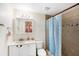 Bathroom featuring a vanity, toilet, and tiled shower with a rainfall showerhead at 6024 90Th N Ave, Pinellas Park, FL 33782