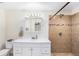 Bathroom showcasing a shower with tiled walls, a large vanity, and ample storage space at 6024 90Th N Ave, Pinellas Park, FL 33782