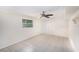 Well-lit bedroom with tile flooring and a ceiling fan, complete with ample space and comfort at 6024 90Th N Ave, Pinellas Park, FL 33782