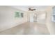 Bright bedroom with tile flooring, ceiling fan, and an ensuite bathroom for added convenience at 6024 90Th N Ave, Pinellas Park, FL 33782