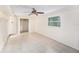 Bright bedroom with tile flooring, ceiling fan, and ample natural light at 6024 90Th N Ave, Pinellas Park, FL 33782