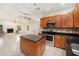 Open kitchen with granite countertops and stainless steel appliances, open to the living room at 6024 90Th N Ave, Pinellas Park, FL 33782