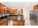Well-equipped kitchen with stainless steel appliances, granite countertops, and an island at 6024 90Th N Ave, Pinellas Park, FL 33782