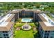 Bird's eye view of complex with amenities including pool and community pergola at 6100 Gulfport S Blvd # 114, Gulfport, FL 33707