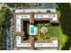 Top-down drone view displays the layout of the condominium building and pool at 6100 Gulfport S Blvd # 114, Gulfport, FL 33707