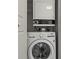Convenient laundry closet with stacked washer and dryer set at 6100 Gulfport S Blvd # 114, Gulfport, FL 33707