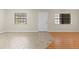 Spacious living room with tile floors, large windows, and natural light at 6100 Gulfport S Blvd # 114, Gulfport, FL 33707