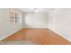 Bright living room with hardwood floors, ceiling fan and large windows at 6100 Gulfport S Blvd # 114, Gulfport, FL 33707