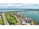 Stunning aerial view of the waterfront condo complex with access to a golf course and stunning bay views at 6322 Palma Del Mar Blvd S # 604, St Petersburg, FL 33715
