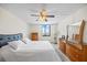 Bright bedroom featuring a large window, a comfortable bed, and matching dressers with ample storage space at 6322 Palma Del Mar Blvd S # 604, St Petersburg, FL 33715