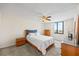 Serene bedroom offers a comfortable bed, dresser, and a window providing natural light and neighborhood views at 6322 Palma Del Mar Blvd S # 604, St Petersburg, FL 33715