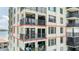 Low-angle view of the condo exterior with balconies at 6322 Palma Del Mar Blvd S # 604, St Petersburg, FL 33715