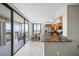 Modern kitchen with stainless steel appliances and granite countertops near balcony at 6322 Palma Del Mar Blvd S # 604, St Petersburg, FL 33715