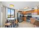 Open kitchen features stainless steel appliances and a table for easy dining at 6322 Palma Del Mar Blvd S # 604, St Petersburg, FL 33715