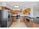 Well-equipped kitchen featuring stainless steel appliances and granite countertops at 6322 Palma Del Mar Blvd S # 604, St Petersburg, FL 33715