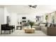 Spacious open-concept living room with modern decor, stylish furniture, and plenty of natural light at 6350 Journey Way, New Port Richey, FL 34655