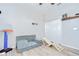 Bright bedroom featuring a modular sofa, ' slide, and classic double door closet at 6519 Twin Bridges Dr, Zephyrhills, FL 33541