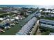 Panoramic aerial view of waterfront condo community with canals leading to open water at 659 Garland Cir, Indian Rocks Beach, FL 33785