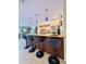 Kitchen featuring a large island with granite countertop, pendant lights, and bar stool seating at 659 Garland Cir, Indian Rocks Beach, FL 33785