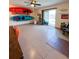 Large living area with kayaks mounted on the wall, leading to a backyard patio at 659 Garland Cir, Indian Rocks Beach, FL 33785